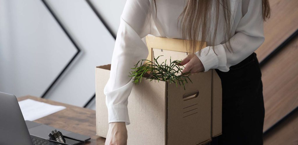 high-angle-woman-with-cardboard-box